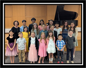 A group of children and adults posing for a photo

AI-generated content may be incorrect.
